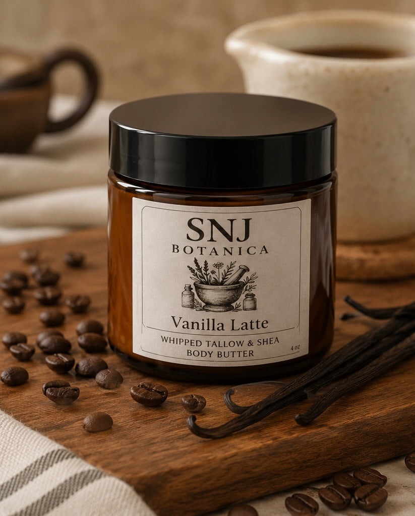 Jar of SNJ Botanica Vanilla Latte body butter with coffee beans and vanilla on a wooden board.