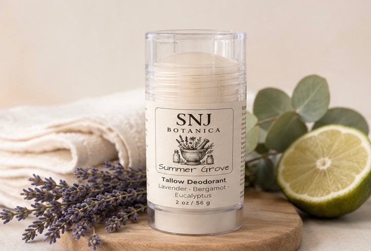 SNJ Botanica Summer Grove deodorant stick with lavender, bergamot, and lime on a wooden board.