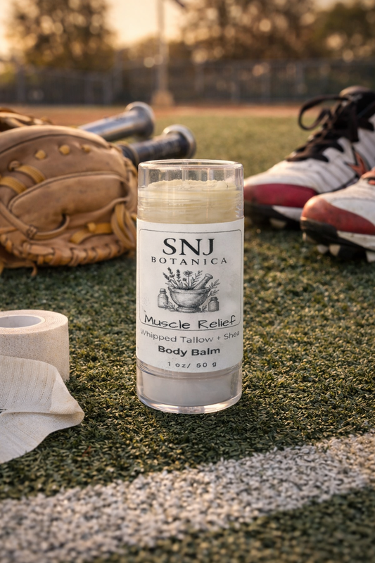 Body balm stick labeled 'SNI Botanica' on a sports field with sports equipment in the background