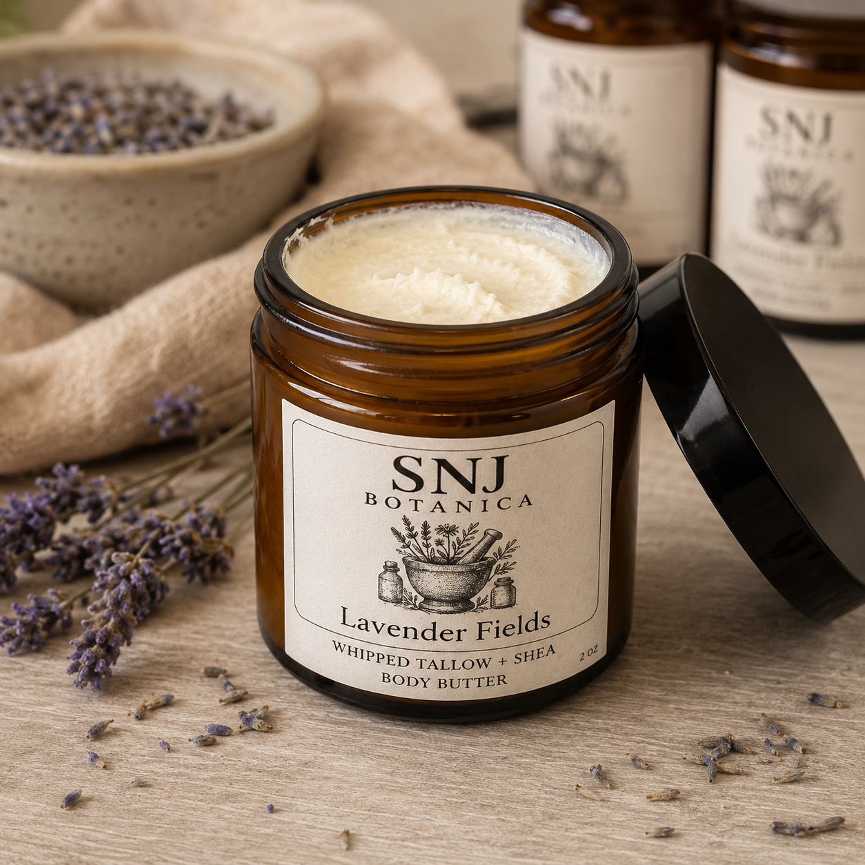 Jar of SNJ Botanica Lavender Fields body butter with lavender flowers on a wooden surface