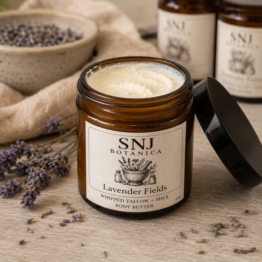 Jar of SNJ Botanica Lavender Fields body butter with lavender flowers on a wooden surface